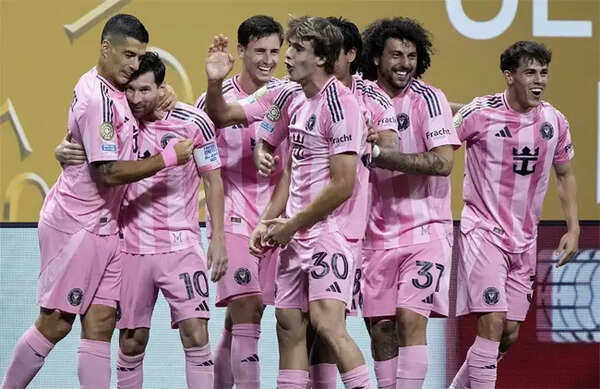 Lionel Messi celebrates goal with Luis Suarez
