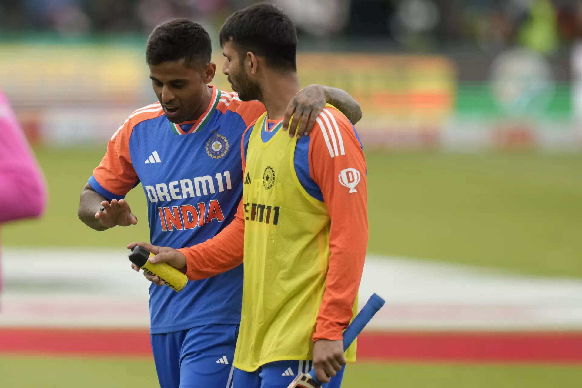 India's captain Suryakumar Yadav, left, and Jitesh Sharma leave the field after ...